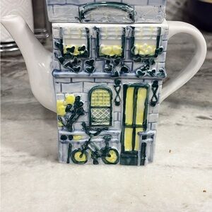 Charming House Teapot with Bicycle Design